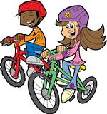 Two students riding bikes 
